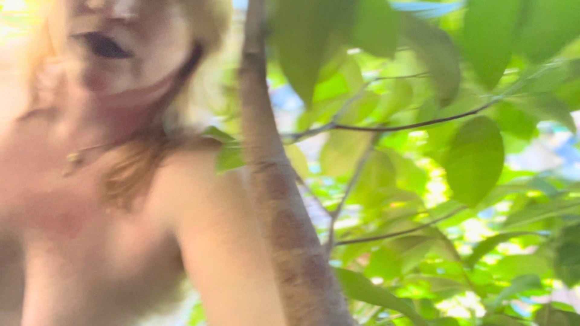 This Morning I Was Gathering Daffodils, further work. A face blurred among bright green leaves.